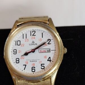 Seiko gold-tone watch with white dial and black numerals